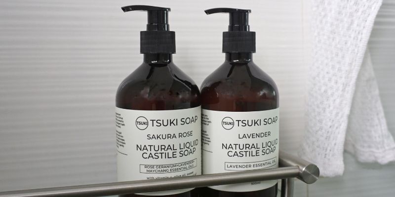 Natural Handmade Castile Soap. 2 bottles in the shower. Sakura Rose Castile Liquid Soap and Lavender Castile Liquid Soap. Gentle and mild natural handmade castile soaps that are great for your skin.