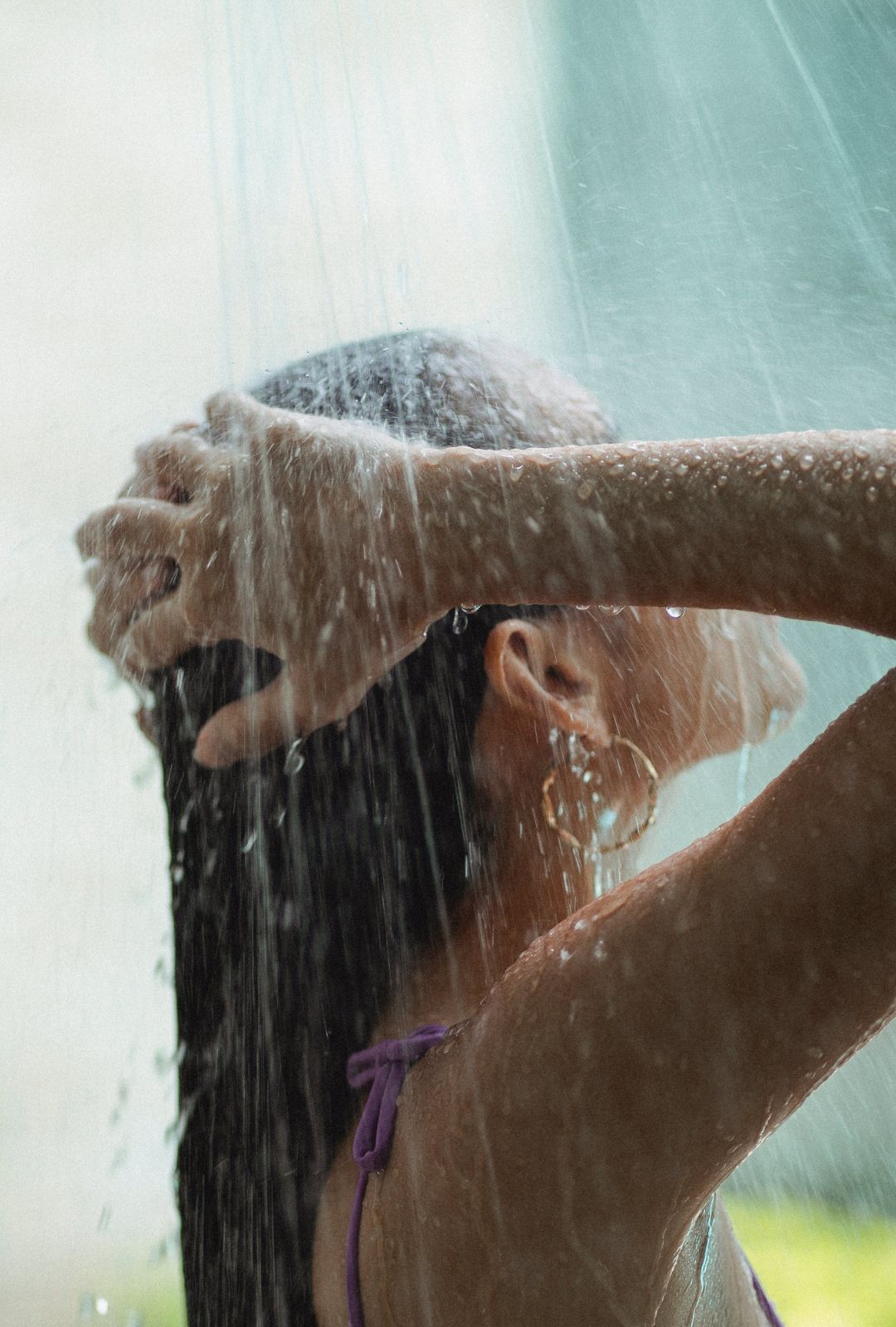 woman showering with natural soap